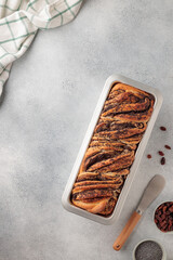 Fresh-baked swirl homemade bread with poppy seeds and raisins