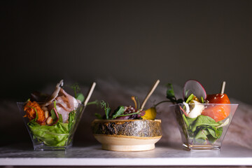 three types of bruschettes on a tray . assorted sandwiches