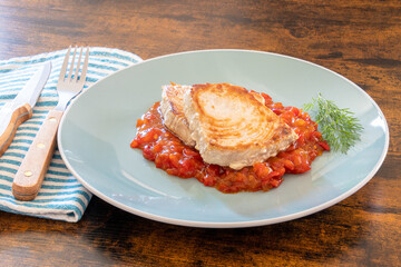 tuna steak cooked in a sweet and sour sauce
