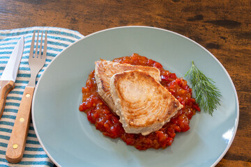 tuna steak cooked in a sweet and sour sauce