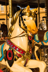 close up detail of a carrousel - merry-go-round - in the city square - Florence, Italy 