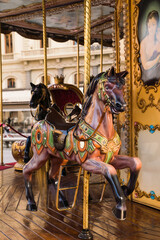 close up detail of a carrousel - merry-go-round - in the city square - Florence, Italy 
