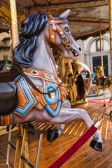 Fototapeta na wymiar close up detail of a carrousel - merry-go-round - in the city square - Florence, Italy 
