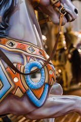 close up detail of a horse carrousel - merry-go-round - in the city square - Florence, Italy 