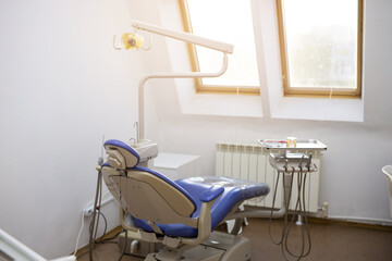 modern office with comfortable blue armchair in dentistry clinic