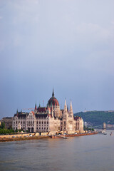 Obraz premium The Hungarian Parliament Building on the bank of the Danube in Budapest.