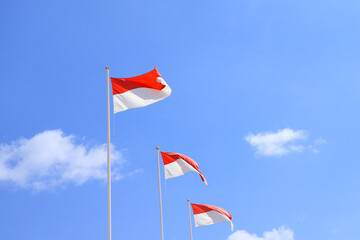 3 Monaco flags waving in the wind
