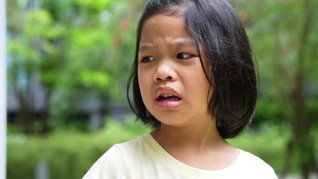 Portrait of Asian angry, sad and cry little girl, The emotion of a child when tantrum and mad, expression grumpy emotion. Kid emotional control concept