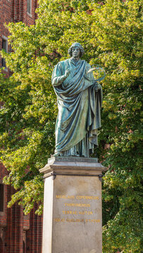 view of the statue of Nicholas Copernicus in the Old Town of Torun