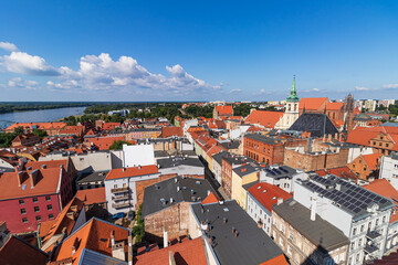 view of the old town of Torun and the Vistula river from above during a warm summer day.