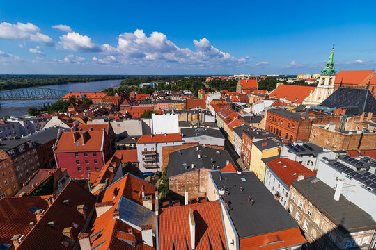 view of the old town of Torun and the Vistula river from above during a warm summer day.