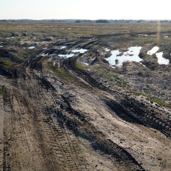 Spring landscape. Dirty spring road. Impassability and mudslides.