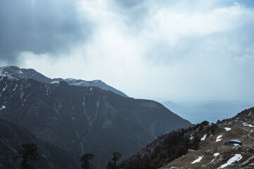 A beautiful view of the Dhauladhar Himalayan Range on a clear day at Triund Top, Himachal Pradesh,...