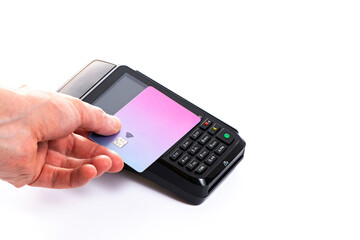 Attached plastic card to the payment terminal with a man's hand on a white isolated background, copy space