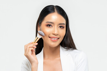 Happy Asian woman applying makeup