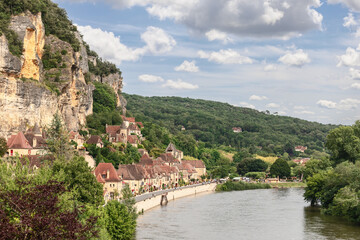 Built on rocky high bank of Dordogne river, La Roque-Gageac village is masterpiece of medieval...