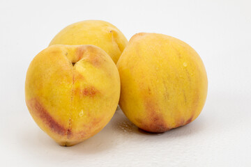 Peaches isolated in white background. Different angles of peach. Shot in studio lighting.  Shot using macro lens. Crystal clear detailing and texture. 