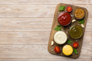 Many different sauces and herbs on table, flat lay top view. sauces on plate, healthy concept