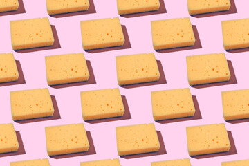 pattern made with yellow sponge for washing dishes, blue household cleaning sponge, sponges for washing dishes and other domestic needs.
