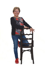 senior woman playing wiyh chair on white background