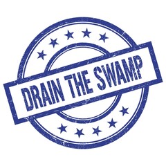 DRAIN THE SWAMP text written on blue vintage round stamp.