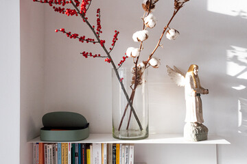 Branches and angel statuette Christmas decoration