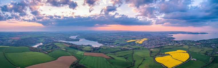 Sunset over Devon Fields and Farmlands from a drone, Paignton and Brixham, River Dart, England