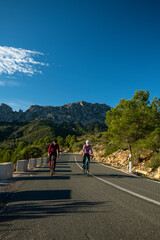 Cyclists in the hills in and around Calpe village with Bernia mountain in the background, area very...
