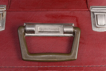 Handle of the old hardshell suitcase close-up
