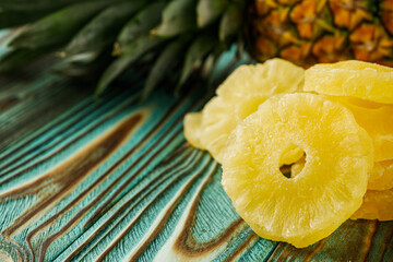 delicious dried pineapple on a wooden rustic background