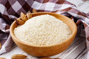 almond flour on a white wooden rustic background