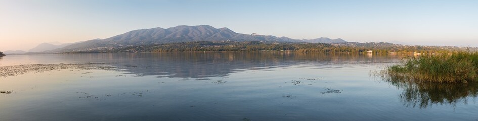 Obraz premium Lake at sunset, north Italy. Lake Varese (lago di Varese) with in the background the Campo dei Fiori massif. Famous because it hosts rowing competitions of national, european and world level