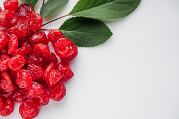 dried cherry berry on a white acrylic background