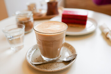 Coffee and Cake on wooden table in the cafe