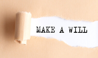 The text MAKE A WILL appears on torn paper on white background.