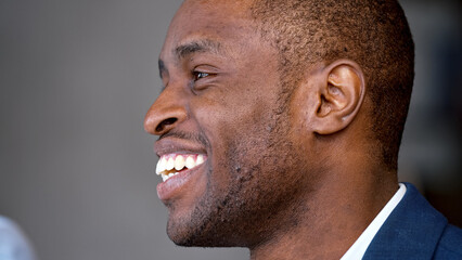 Portrait of a smiling african american man in a suit at a business meeting