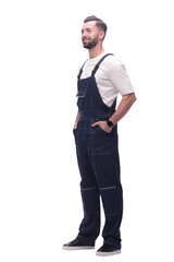 in full growth. smiling man in overalls.