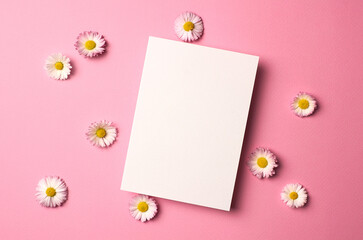 Blank invitation or greeting card mockup with daisy flowers