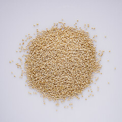 white quinoa seeds on a white acrylic background