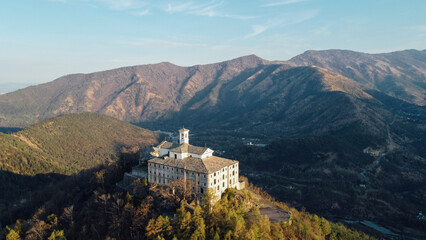 Fototapeta premium Aerial view of Sanctuary of Saint Ignatius of Loyola situated in the Lanzo Valleys in Italy. Tourist attraction and famous place of pilgrimage in Province of Turin, Piedmont region. Drone photography.