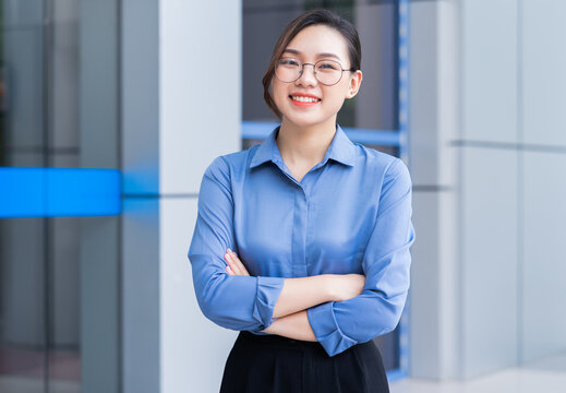 Image of young Asian businesswoman outside