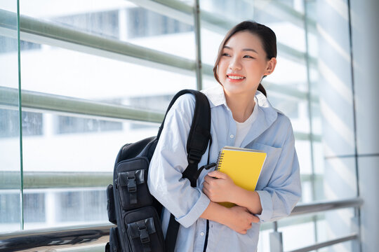 Image of young Asian college girl at school