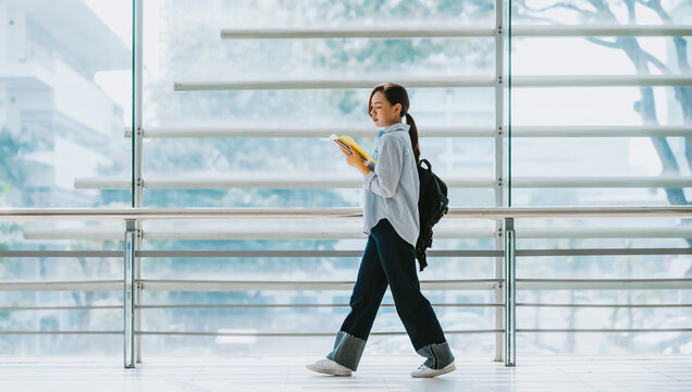 Image of young Asian college girl at school