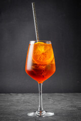 bright colored alcoholic cocktail on a black stone background