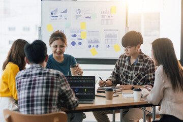 Meeting a group of young entrepreneurs brainstorming business plans and share ideas in the workshop. Start up business.