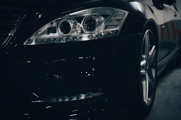 beautiful headlights of a black car.