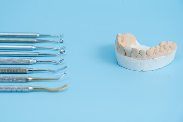 Dentist tool set. Teethcare, dental health concept. Blue background top view copy space