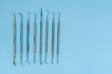 Dentist tool set. Teethcare, dental health concept. Blue background top view copy space