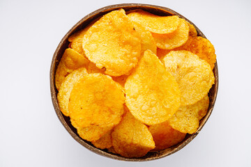 golden crispy potato chips on a white background