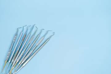 Dentist tool set. Teethcare, dental health concept. Blue background top view copy space